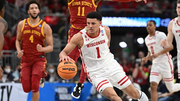 Wisconsin Badgers guard Johnny Davis (1) drives to the basket against Iowa State Cyclones guard Tyrese Hunter (11) during the first half during the second round of the 2022 NCAA Tournament.